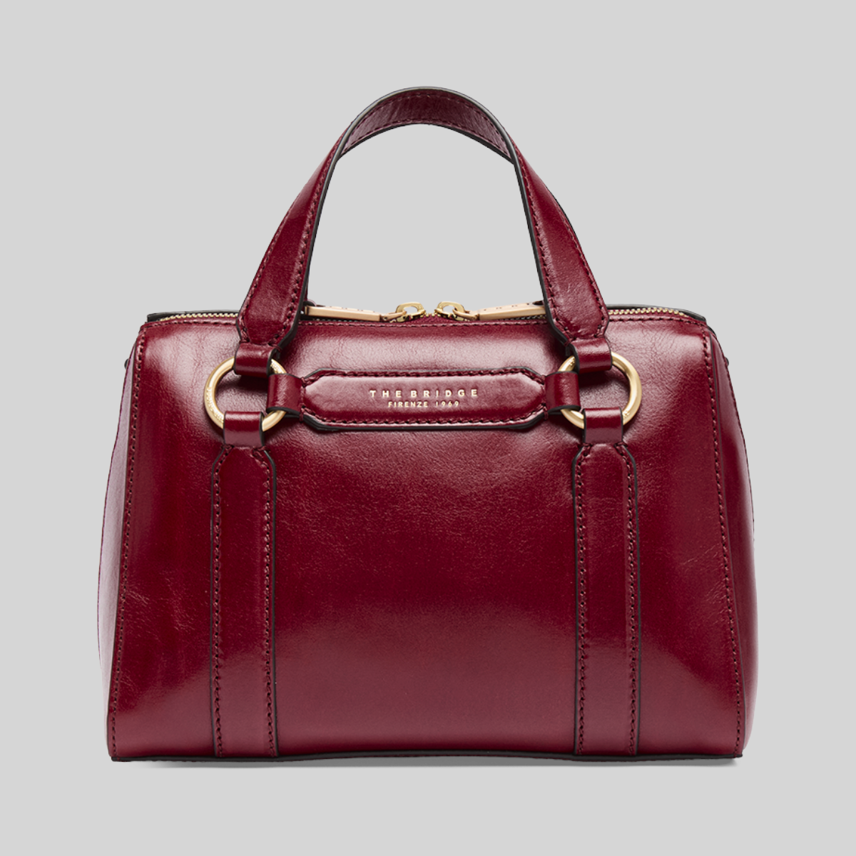 Borsa a mano LIBUTTI in pelle color bordeaux con dettagli dorati e tracolla removibile