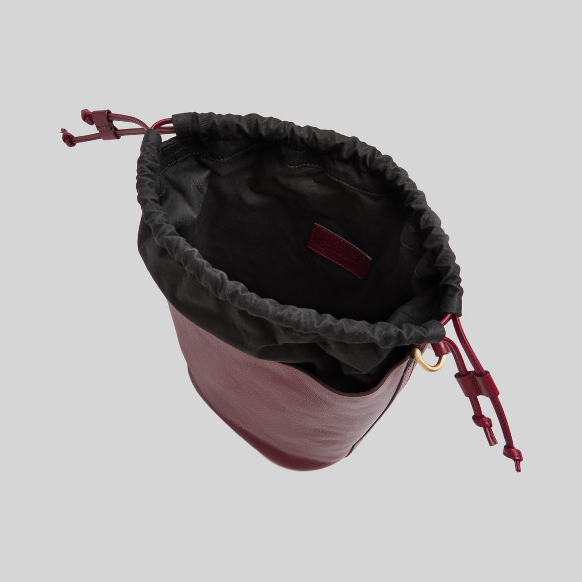 Borsa secchiello LIBUTTI linea Luce in pelle color Barolo con sacca interna nera removibile e chiusura a coulisse