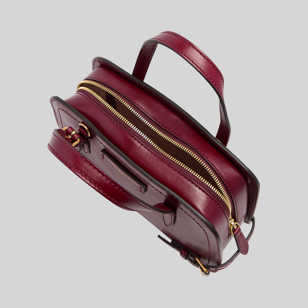 Borsa a mano LIBUTTI The Bridge linea Monica in cuoio bordeaux con chiusura a zip dorata e design essenziale