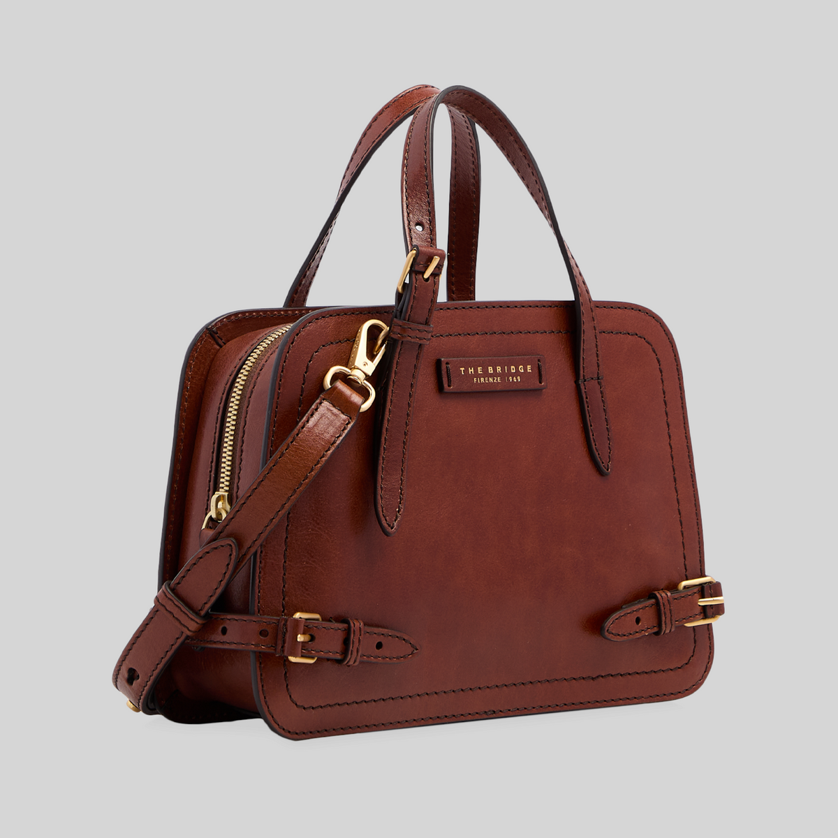 Borsa LIBUTTI The Bridge linea Monica in cuoio marrone con dettagli dorati, design elegante e artigianale.