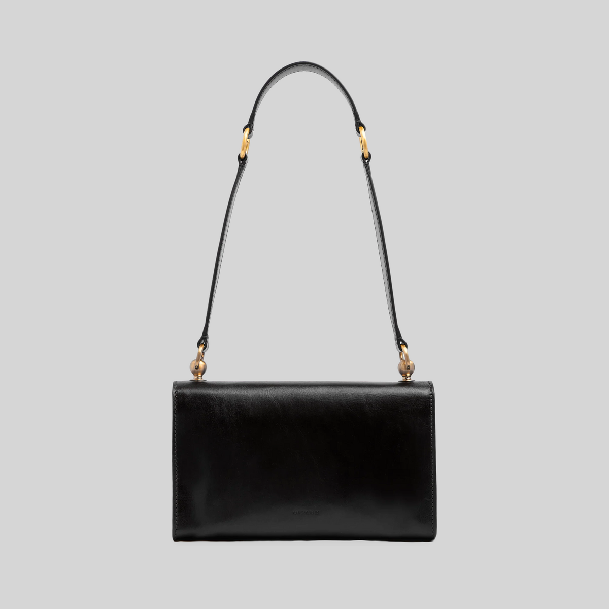 Borsa a spalla LIBUTTI in pelle nera con tracolla regolabile e dettagli in metallo dorato, design artigianale italiano