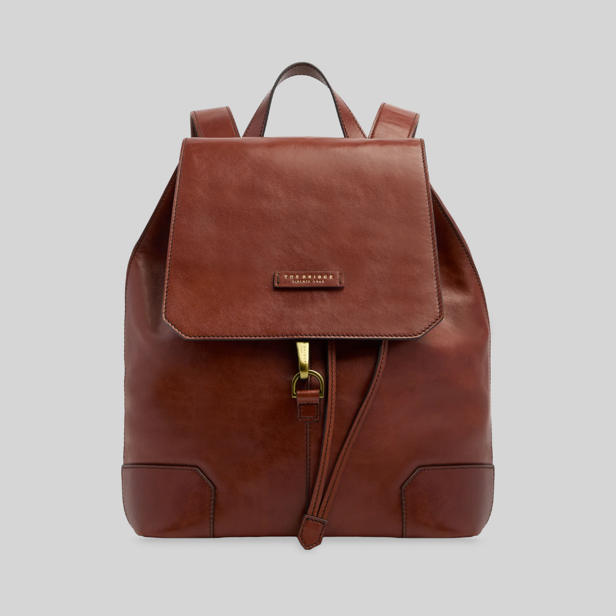 Zaino LIBUTTI The Bridge in pelle marrone con patta, chiusura a coulisse e dettagli in metallo dorato