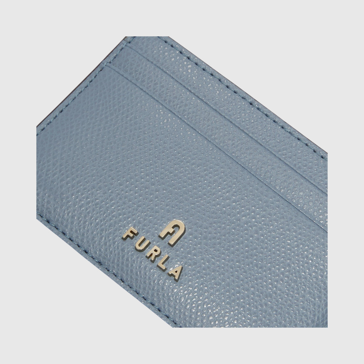Portacarte di credito LIBUTTI Furla Camelia in pelle azzurra con logo metallico frontale
