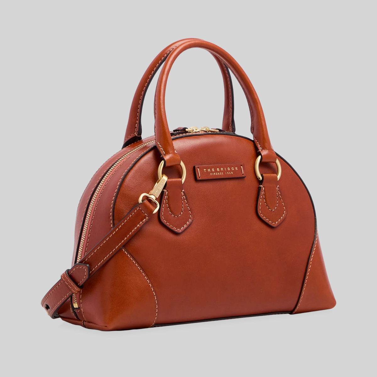 Borsa LIBUTTI in pelle marrone con silhouette arrotondata, manici rigidi e tracolla removibile, stile elegante.