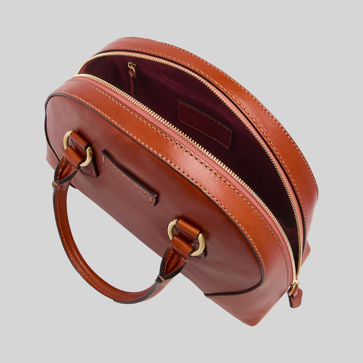 Borsa LIBUTTI in pelle marrone con silhouette arrotondata, cerniera dorata e tracolla removibile