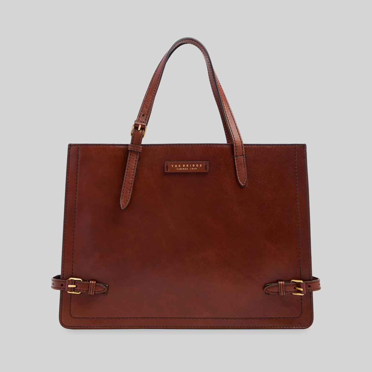 Borsa shopping LIBUTTI in pelle marrone pieno fiore con manici lunghi, tracolla regolabile e dettagli in metallo oro.