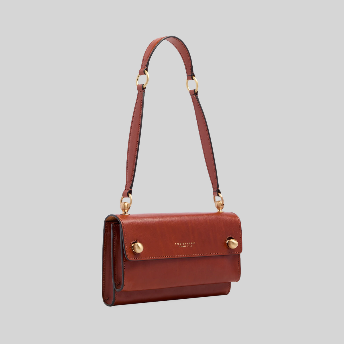 Borsa a spalla LIBUTTI in pelle color cuoio con dettagli dorati e tracolla regolabile, design artigianale italiano.