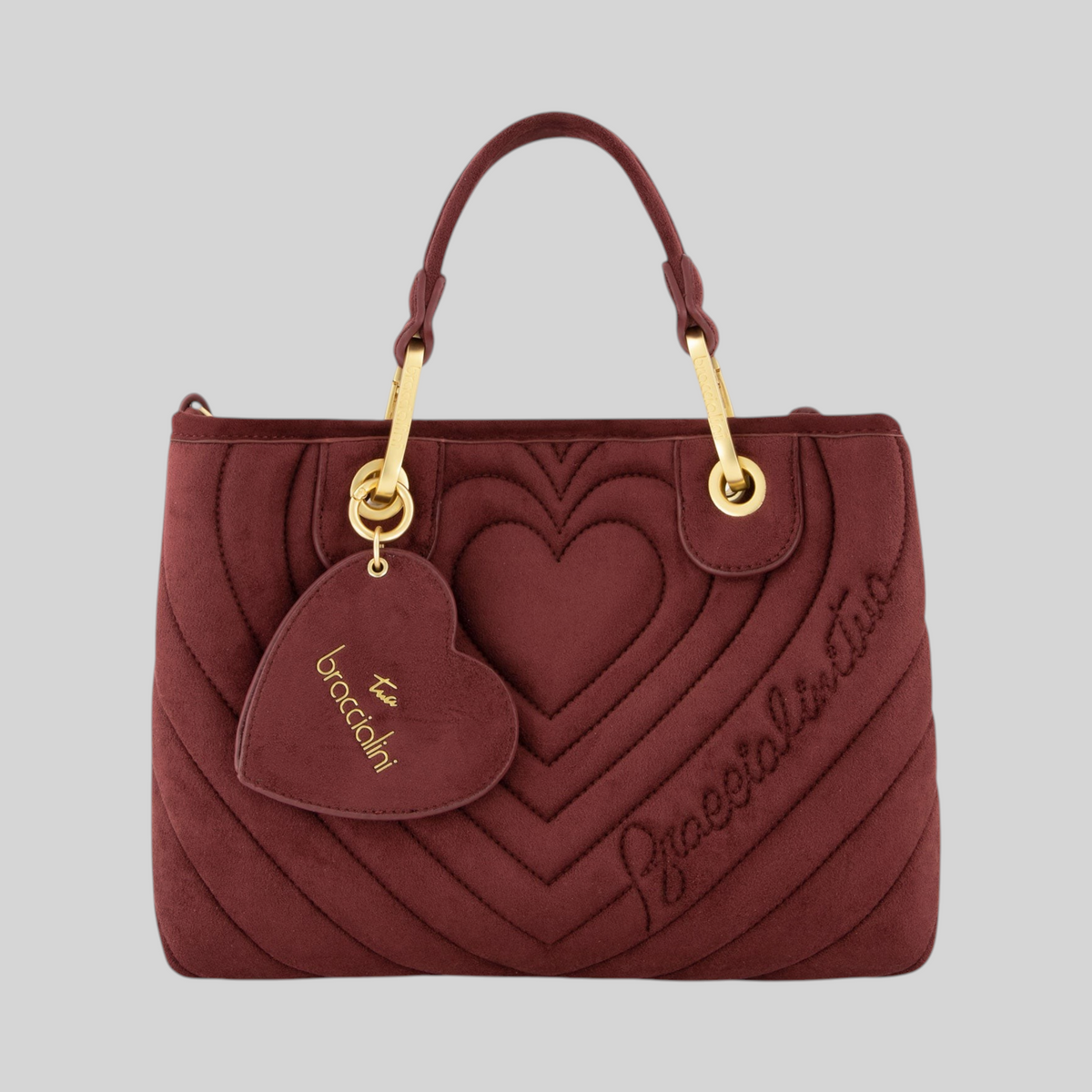 Borsa a mano LIBUTTI in suede bordeaux con trapuntatura a cuori, doppi manici e ciondolo a forma di cuore