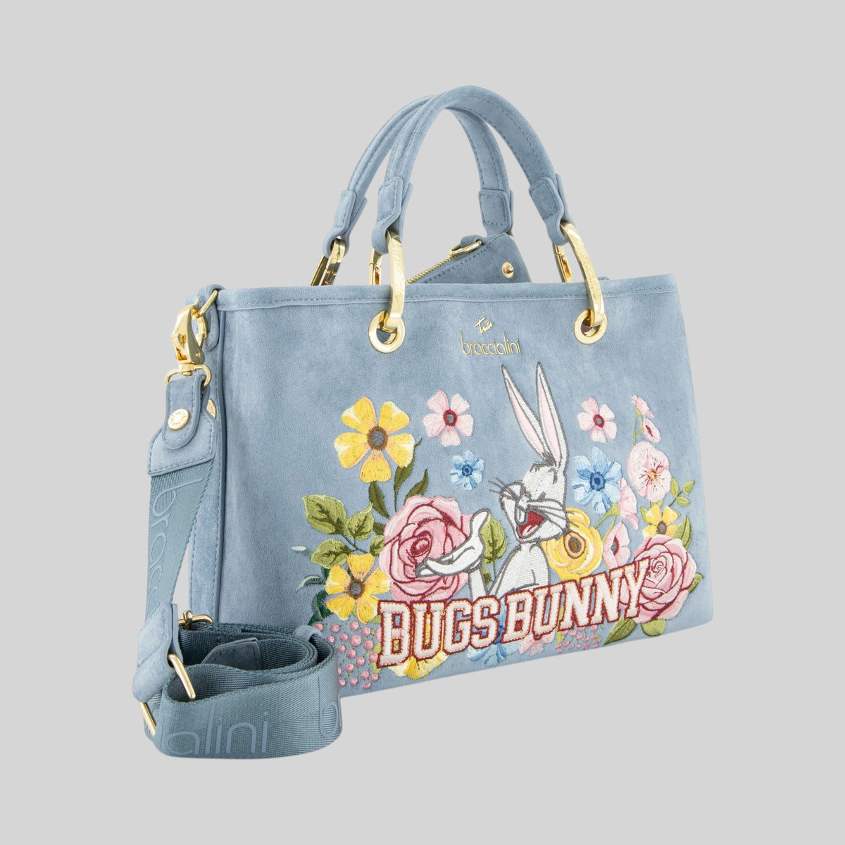 Borsa LIBUTTI Beth in suede color polvere con ricamo Bugs Bunny, fiori e dettagli dorati, tracolla removibile.