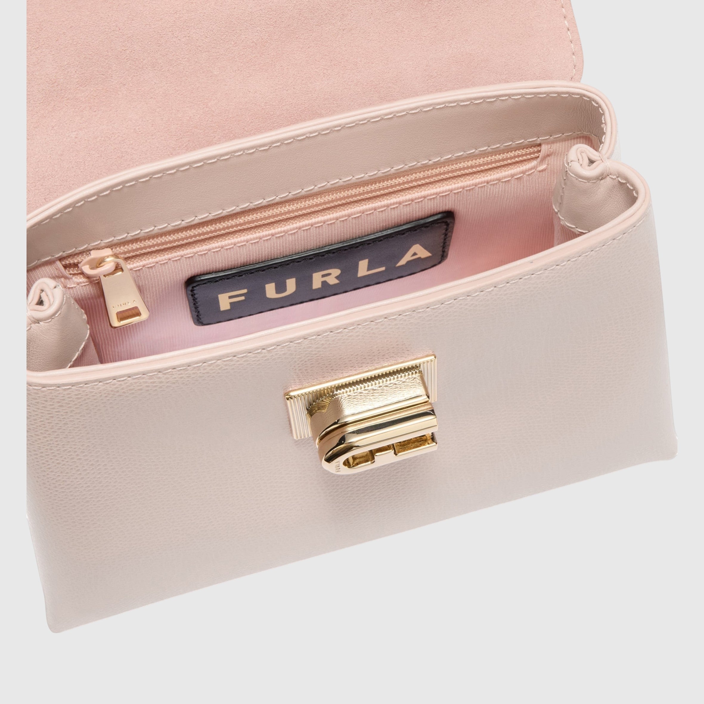 Interno della mini borsa LIBUTTI Furla 1927 in pelle rosa con logo Arco e chiusura a girello dorata