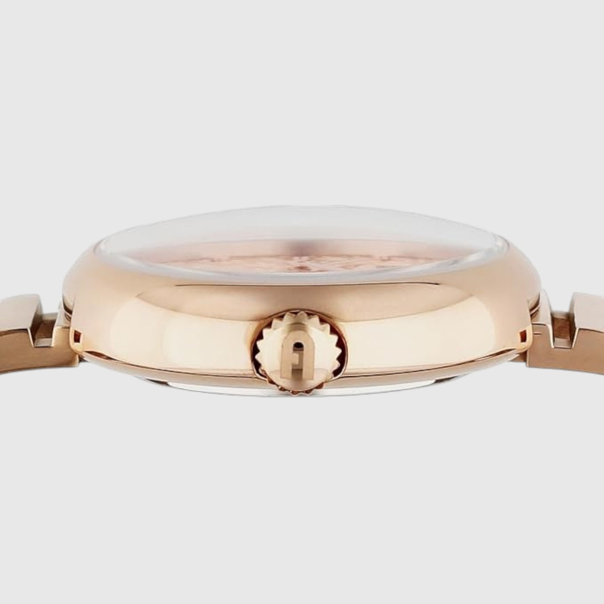Dettaglio laterale della cassa in acciaio color oro rosso dell'orologio LIBUTTI Furla con corona logata