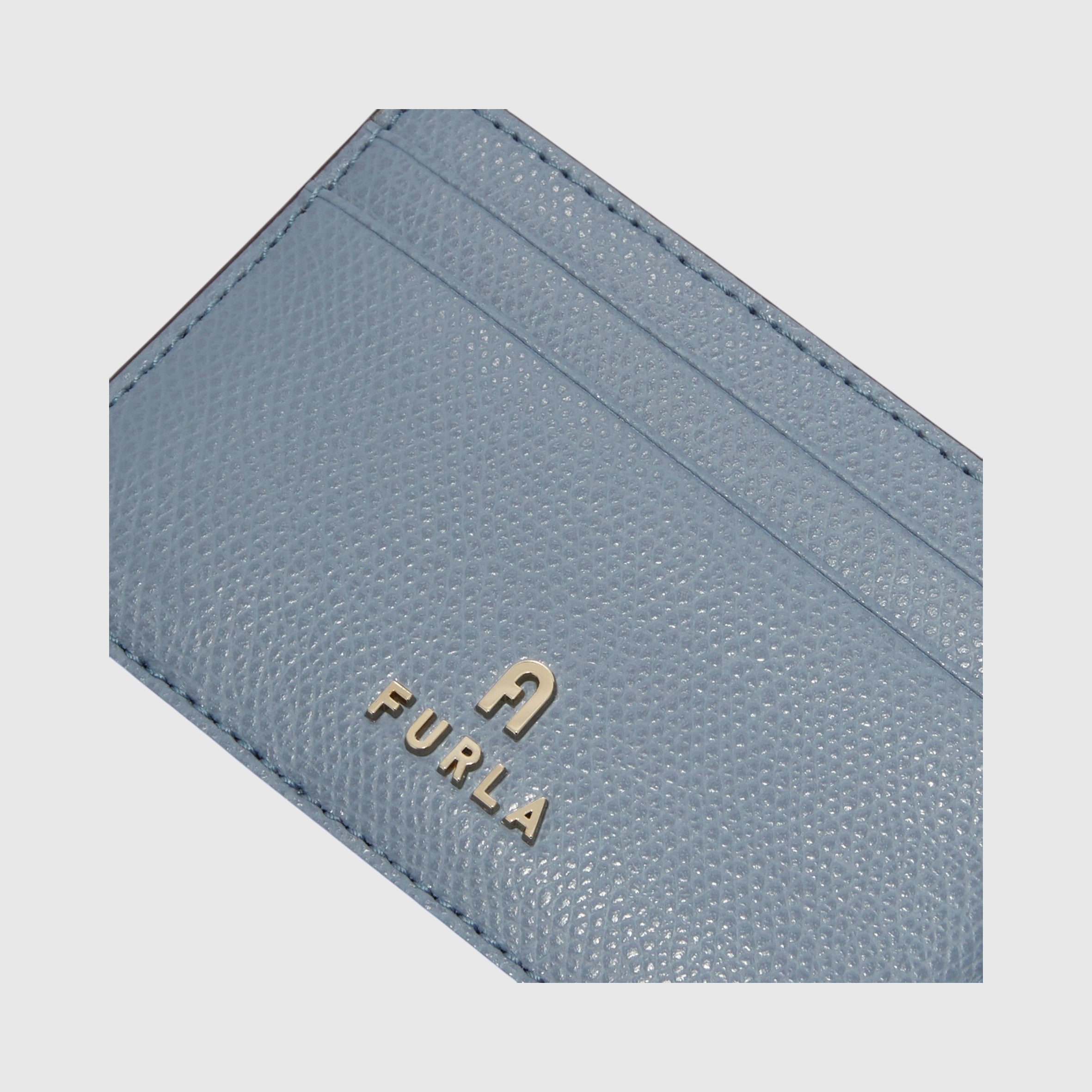 Portacarte di credito LIBUTTI Furla Camelia in pelle azzurra con logo metallico frontale