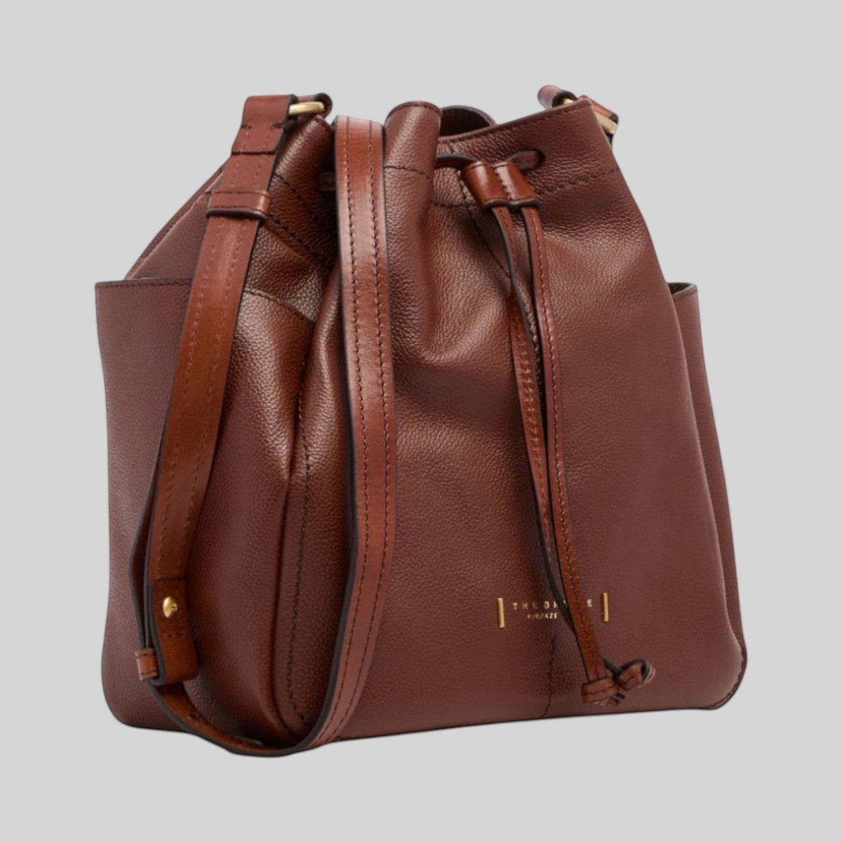 Borsa secchiello LIBUTTI in pelle di vacchetta marrone lucida con tracolla regolabile e chiusura a coulisse